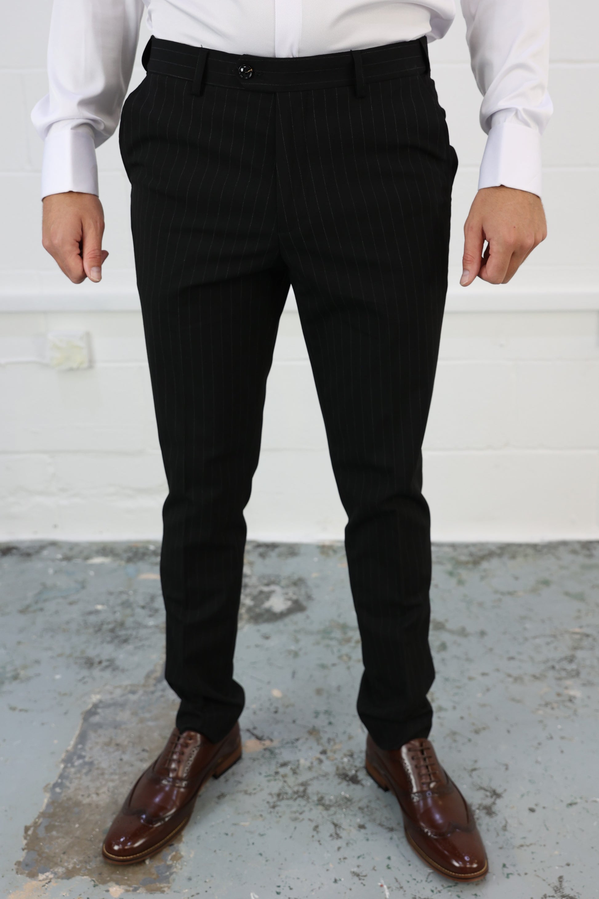 Front view of Suitbae black pinstripe slim tailored fit tapered trousers, featuring a modern design with an elastic waistband for enhanced comfort; sold individually, perfect for formal or smart-casual wear.