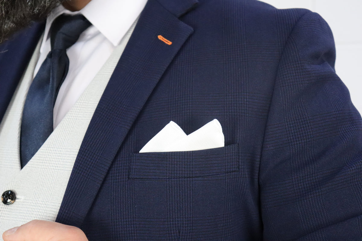 Close-up of the SUITBAE Charles Navy with Contrast Stone Waistcoat Three Piece Suit — featuring a navy check blazer with subtle texture, white pocket square, and navy tie over a light stone waistcoat — refined style ideal for weddings and race days — available at SUITBAE Blackpool, Barnsley and shpxlxnx.top.