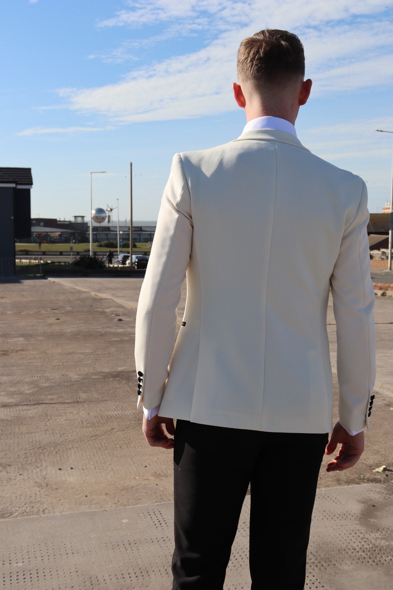 Back view of the SUITBAE Diablo Ivory Tuxedo jacket, showcasing the clean ivory fabric, structured shoulders and slim tailored fit — premium men’s tuxedo for weddings, proms and formal events, available in plus sizes.