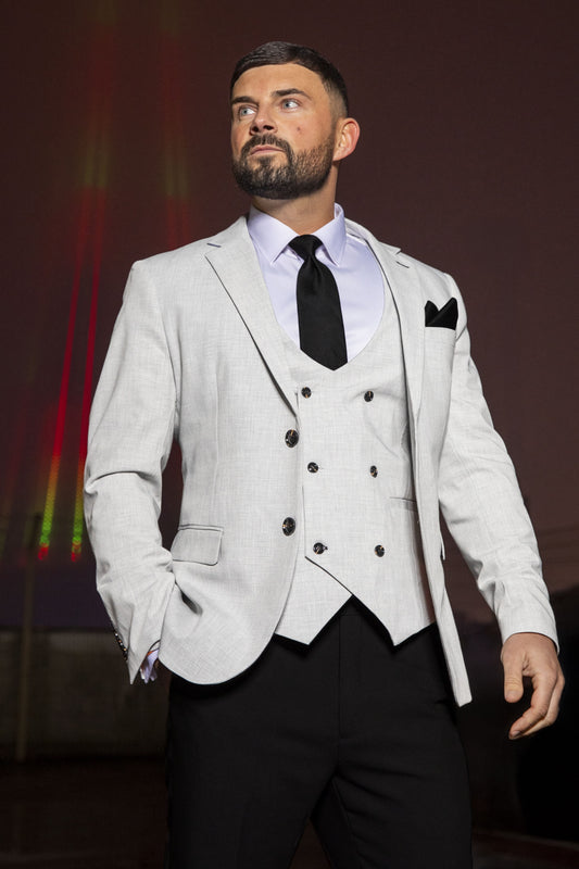Man wearing the SUITBAE Harry with Diablo Trousers Contrast Three Piece Suit, featuring a light stone blazer and double-breasted waistcoat paired with black trousers — a sharp modern look for weddings, proms, and formal events.
